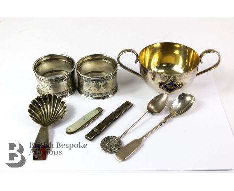 Miscellaneous silver and silver plate, including a silver-plated twin-handled cup; two silver napkin rings, caddy spoon with 