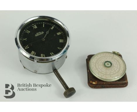 Halden's Calculex circular slide rule, in a maroon case with booklet together with a vintage British Jaeger motor clock havin