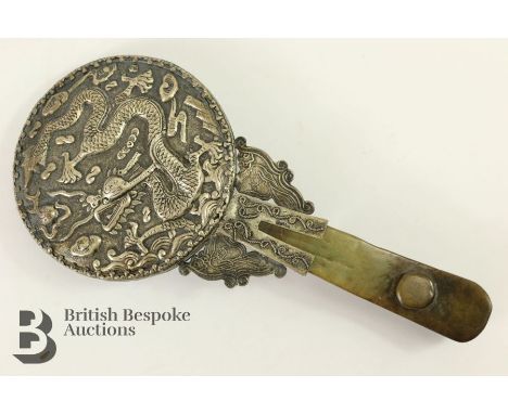 Reproduction Chinese jade and white-metal hand mirror, the handle carved in a reticulated manner to depict a dragon, measures