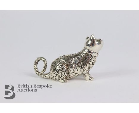 Silver figurine of a cat, having ruby eyes, approx 5 x 3 cms.&nbsp;