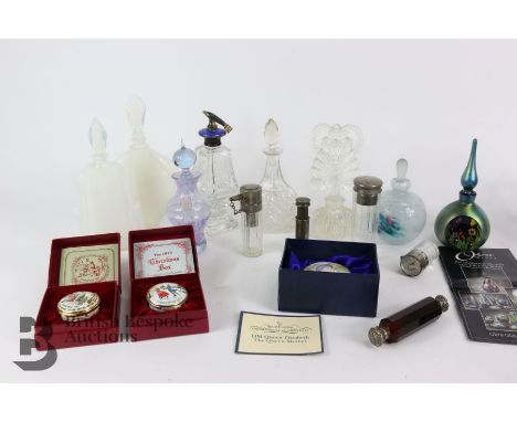 Twelve glass perfume bottles, one engraved with a flower and flower with a blue enamel top, a small jar painted with a femini