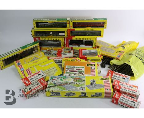 Five boxes of Fleishmann model trains and accessories including boxed locomotive, train engine, three passenger carriages, ac