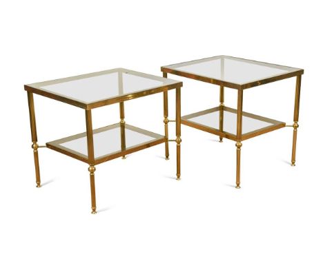A pair of brass two-tier lamp tables, each on fluted column supports51 x 56 x 46cmIn good overall condition.  The brass frame