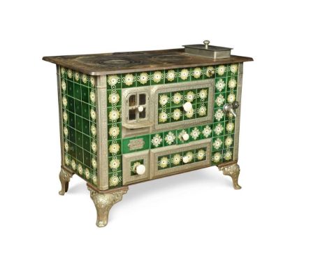 A Continental Art Nouveau cast iron stove, the front and sides with green enamelled tiles, raised on pierced shaped feet80 x 
