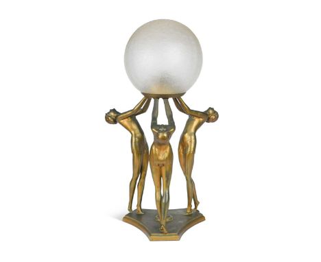 An Art Deco figural lamp, the three gilt spelter maidens raised on a triform base and supporting a spherical glass shade48.5c