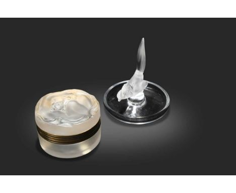Daphne, a Lalique frosted glass powder jar,  the hinged top with gilt metal mounts and modelled with a nude maiden with flowi