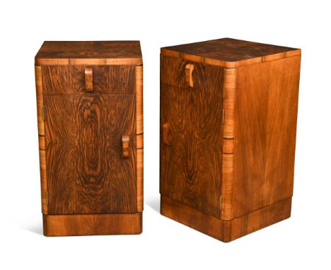 A pair of Art Deco well-figured walnut bedside cabinets, each with single drawer above a cupboard below66 x 37 x 38cmGood ove