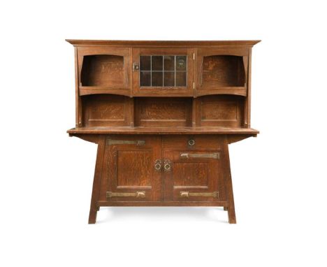 Attributed to Leonard Wyburd for Liberty & Co., an Arts & Crafts oak dresser, the projecting top section with central lead-gl