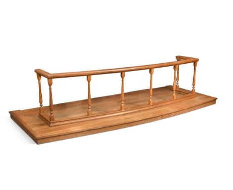 Robert 'Mouseman' Thompson, an oak altar rail, the top supported by eight turned spindles on a base rail, with carved mouse s