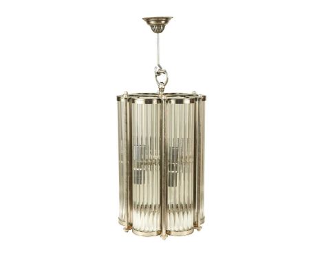 An Art Deco-style polished steel hall lantern, of scalloped form with shaped fluted glazing63 x 35cm diameter