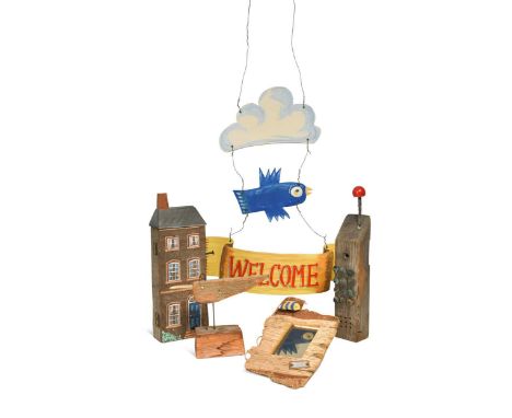 § Tom Karen, a group of wooden models, to include a wooden model of a bird, a painted hanging welcome sign, a driftwood mirro