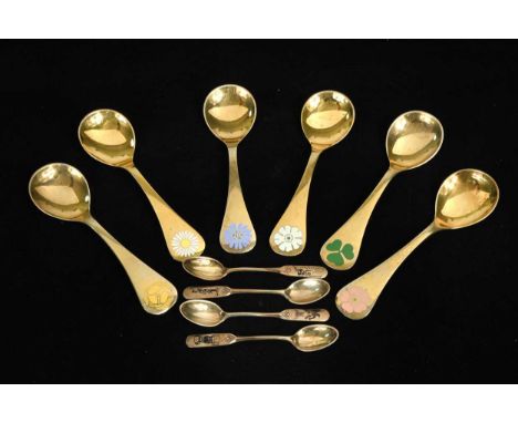 W&S Soerensen Denmark, a set of twelve Danish gilt metalwares coffee spoons, each with a black enamel depiction of characters