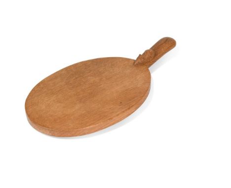 Robert 'Mouseman' Thompson, an oak cheese board, of standard form and bearing the carved mouse signature to the handle39.5cm 