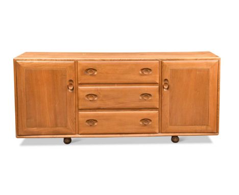 An Ercol elm 'Windsor' sideboard, with three central doors flanked by a cupboard to either side, raised on castors68 x 155 x 