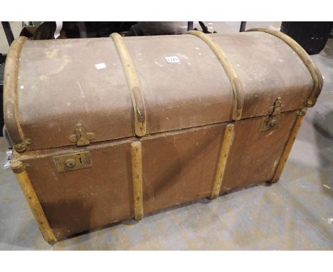 Large wood bound cabin trunk with loose lid containing vintage tennis racquets and walking sticks. Not available for in-house