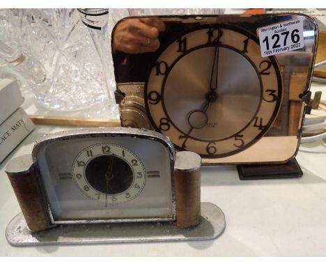 Smiths peach mirrored mantel clock, 18 x 16 cm H and a further Art Deco mechanical clock, 19 x 10 cm H. Both with damages (mi