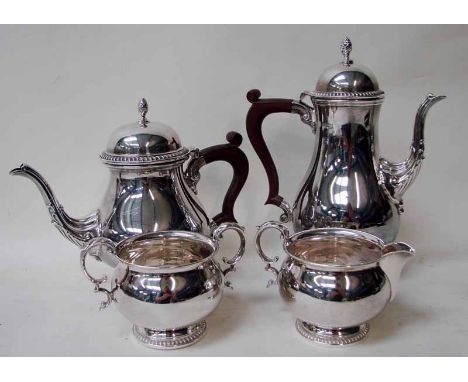 A third quarter 20th century silver four-piece tea service of baluster form consisting of a teapot and water jug with gadroon