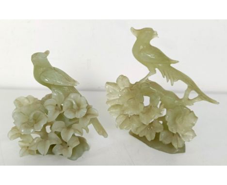 A Chinese green stone carving of a bird, 20 cm, and another, 15 cm (2)