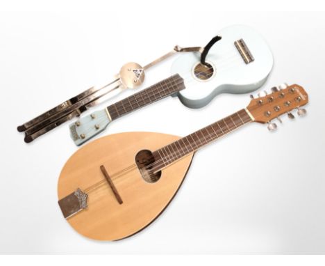 A Gremlin model CR3120 mandolin, a ukulele, and a chrome instrument stand. (1 box)