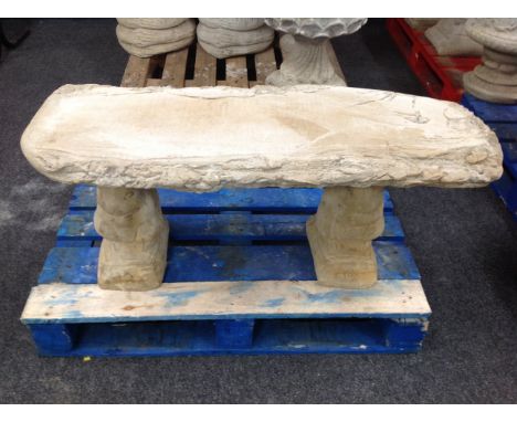 A rustic concrete garden bench on squirrel pedestal, width 101 cm 