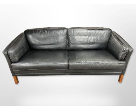 A late 20th-century Danish black leather two-seater settee, length 195cm x depth 80cm x 72cm. CONDITION REPORT: In good condi