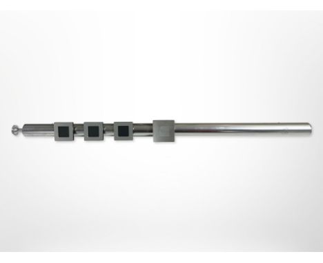 A Bang & Olufsen BeoTime 'flute' alarm wall clock, length 40cm.