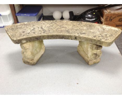 A weathered concrete twin-pedestal garden bench, width 143cm.