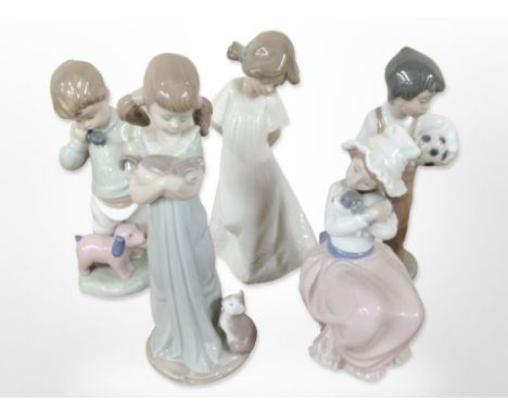 A Lladró figure of a girl holding a kitten, No. 5743, and four further Nao figures of children.