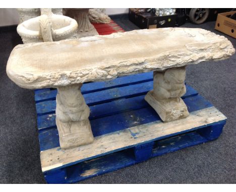 A rustic concrete garden bench on squirrel pedestal, width 101 cm 