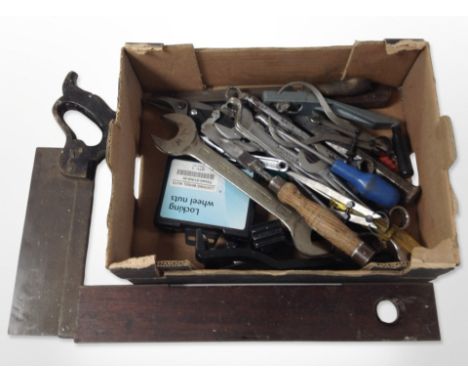 A group of vintage and modern tools including mahogany spirit level, hand saws, spanners, etc.