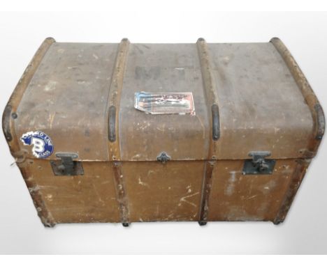 An early 20th-century canvas and wooden-bound trunk, length 84cm.