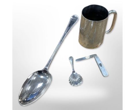 A modern silver shell caddy spoon, a silver and mother of pearl fruit knife, an EPNS tankard and similar basting spoon. 