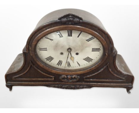 A late Victorian oak mantel clock with silvered dial, height 33cm, together with a further 19th-century long case clock movem