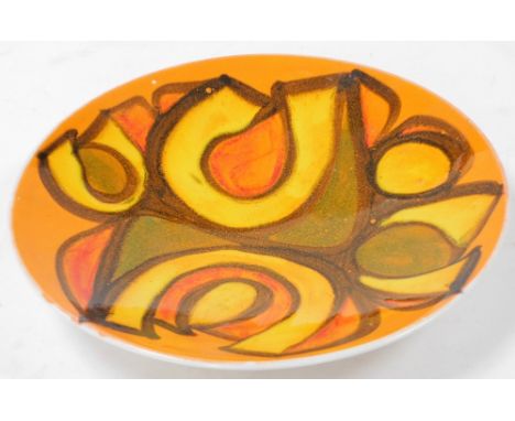 A Poole Pottery Delphis charger, printed marks and signature, 26cm diameter.