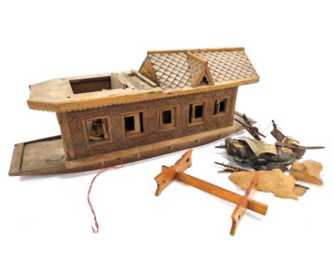 A vintage wooden scale model of an Indian riverboat, with carved decoration, and a fitted interior, 59.5cm wide. 