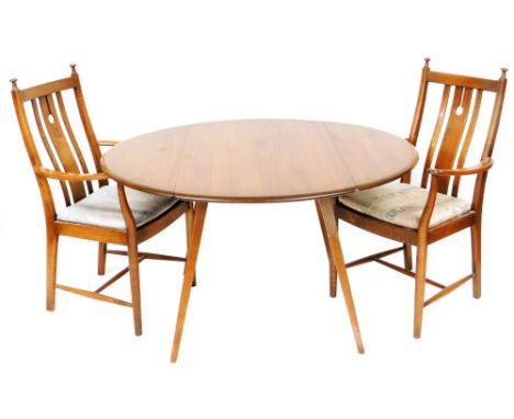 An Ercol dark elm drop leaf dining table, raised on square splayed legs, circa 1970, model number 382, 71cm high, 112cm wide,