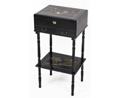 An early 20thC Japanese black lacquer vanity table, with gilt lacquered and mother of pearl inlaid decoration, the hinged lid