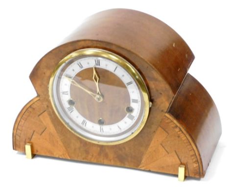 An Art Deco walnut and inlaid sunburst mantel clock, the circular dial with silver chapter ring bearing Roman numerals, Halle