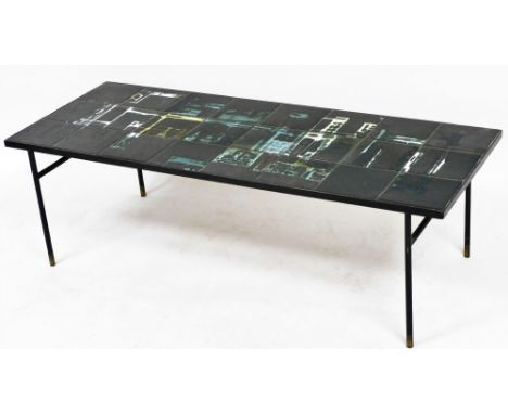 A mid century tile top coffee table, set with twenty four abstract black ground tiles, raised on brass capped black metal rod