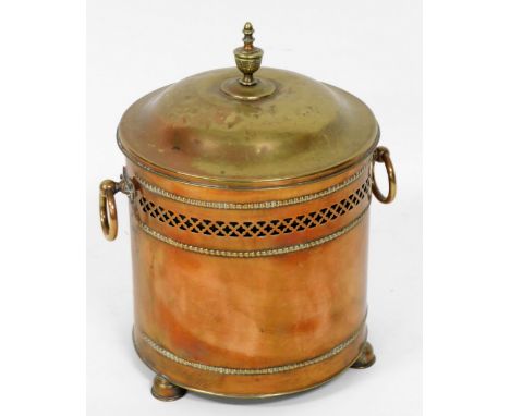 A late 19thC copper lidded coal bucket, with urn finial, two ring handles, and a pierced and raised leaf border to body, rais