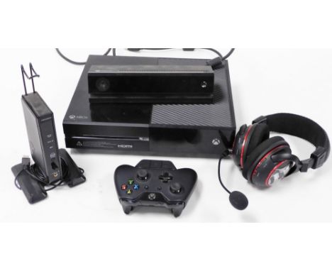An Xbox One console, model 1540, SN102737134948, together with a camera, power unit, games controller, headphones and a Turtl