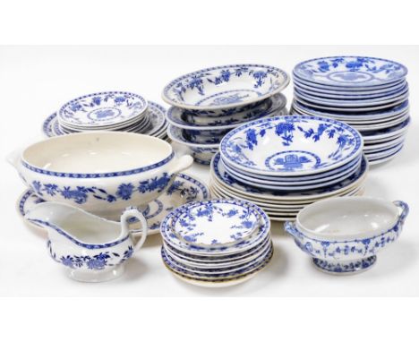 A late 19thC Minton pottery part dinner service, decorated blue and white in the Delft pattern, comprising soup tureen on sta