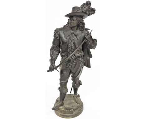 A late 19thC spelter figure of Don Juan, model standing holding a sword, raised on a circular base, 93cm high. (AF)