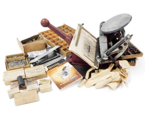 An Adanar printing machine, with instruction manual and various attachments. 