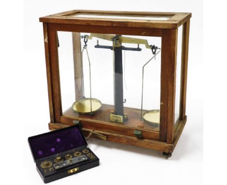 A set of Philip Harris Limited scientific laboratory scales, to weigh up to 250g, cased, 59.5cm wide, together with a set of 