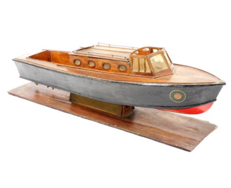A wooden scale model of a vintage naval patrol boat, raised on a wooden stand, 79cm wide. 