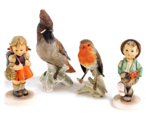 Two Hummel figures, modelled as school girl and globe trotter, together with two Goebel figures of a Waxwing, and a Robin. (4