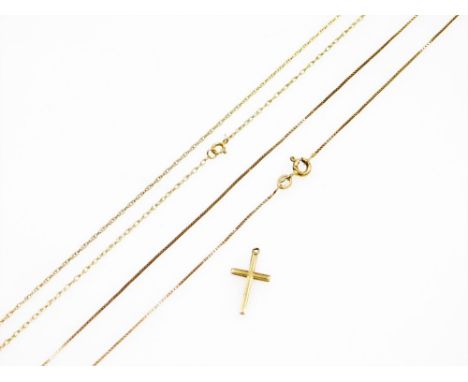 A 9ct gold cross pendant, together with two yellow metal neck chains, on 9ct gold bolt ring clasps, 2.6g all in. 