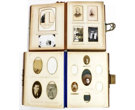 Two Victorian photograph albums, containing some portrait photographs, one album with a musical movement.
