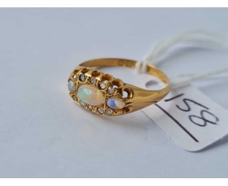 A ATTRACTIVE VICTORIAN OPAL AND DIAMOND CLUSTER RING WITH THREE EXCELLENT CENTRAL OPALS by AA 18ct gold size Q - 2.7 gms